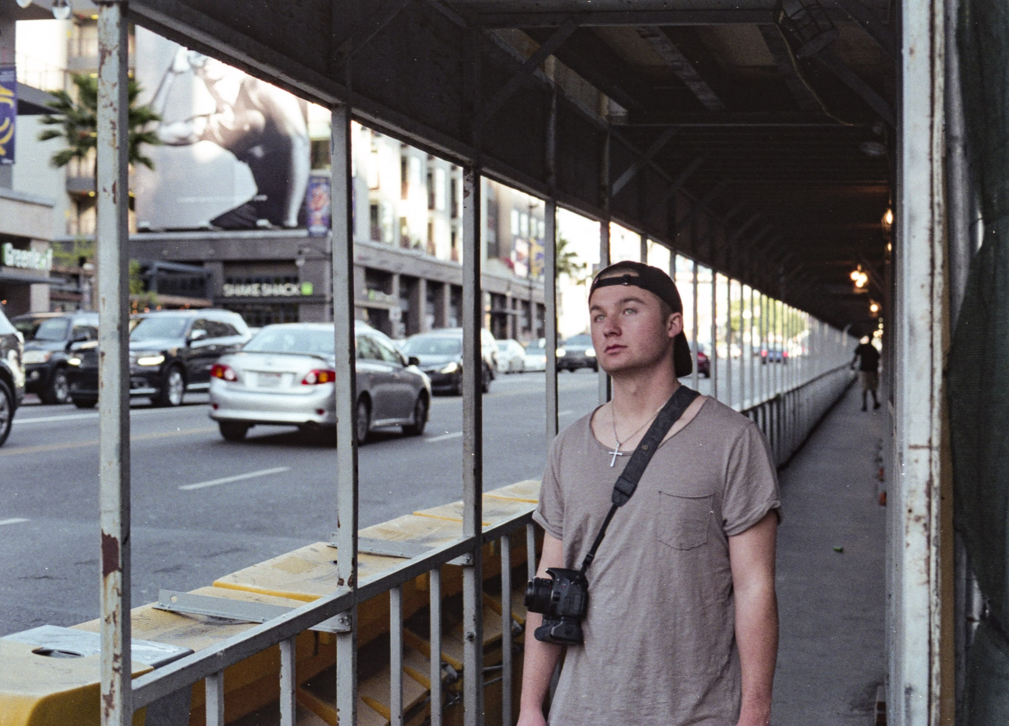 male figure poses in a construction scaffold tunnel, los angeles, 35mm film