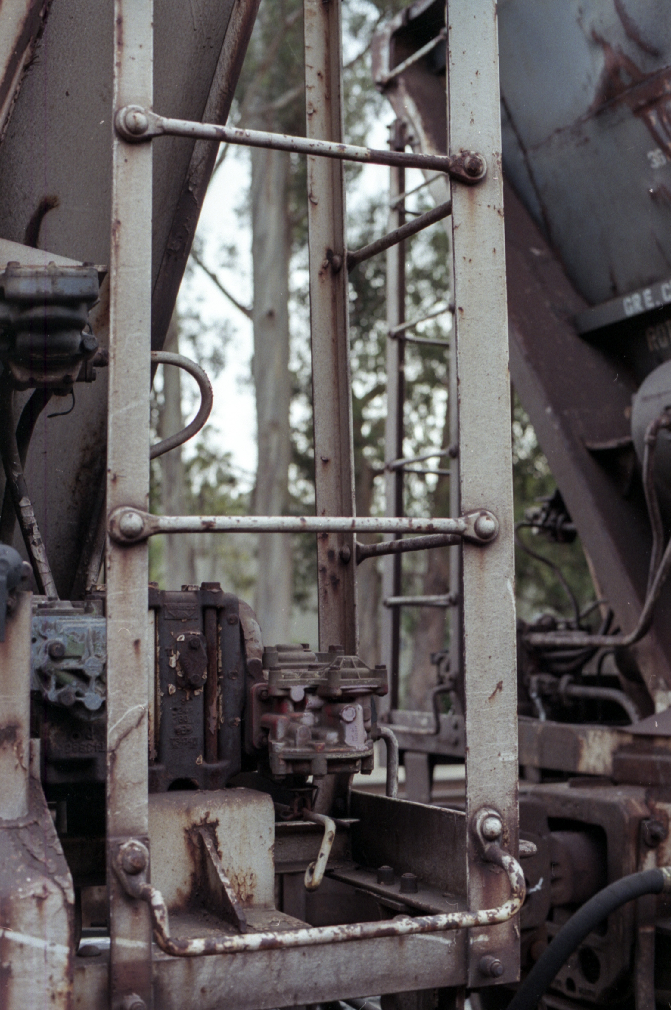 rusty ladder on rear of freight train car, 35mm film