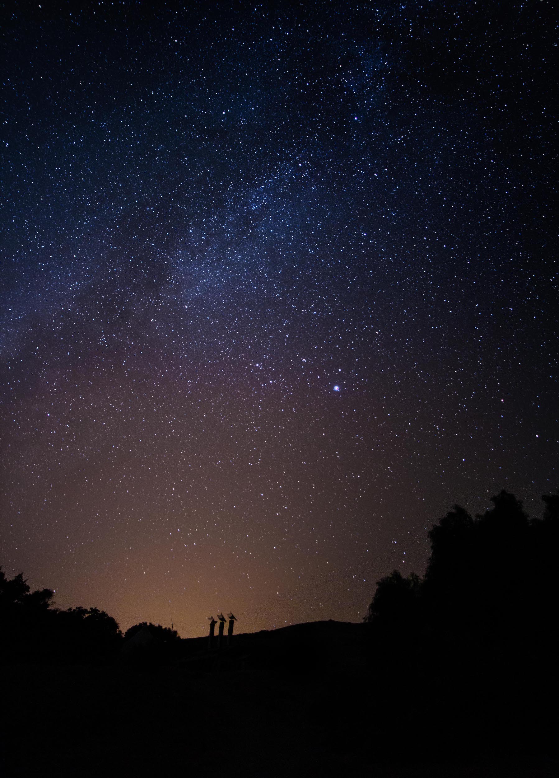 milky way in night sky above cal poly architecture graveyard